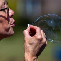 Woman blowing a bubble